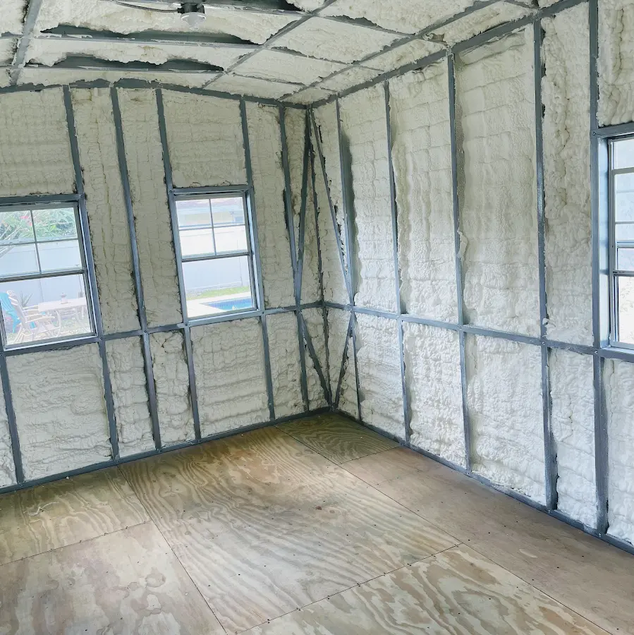 Closed-cell spray foam insulation applied to wall cavities in a residential project in Doraville